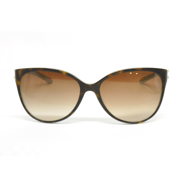 Tiffany & Co. TF 4089-B col. 8134/3B è un occhiale da sole da donna in acetato marrone tartarugato interno verde tiffany, dalla forma cat eye e calibro 58.