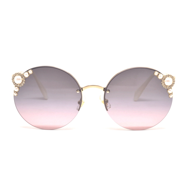 Miu Miu SMU 52T col. VW7-146 è un occhiale da sole in metallo oro e calibro 60.