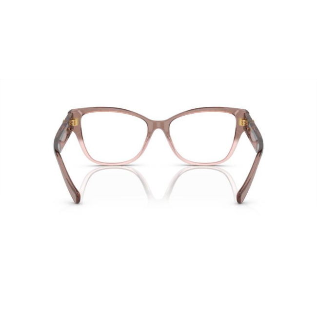 Versace VE 3347 col. 5435 è una montatura da vista da donna in acetato rosa trasparente, dalla forma pillow e calibro 54.