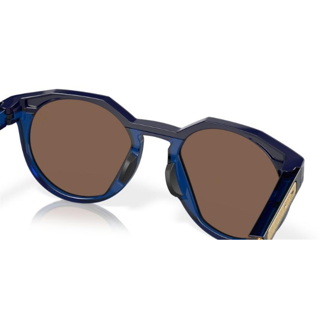 Oakley OO 9242 HSTN KYLIAN MBAPPE' SIGNATURE SERIES col. 11 è un occhiale da sole in acetato blu navy e blu trasparente e calibro 52.