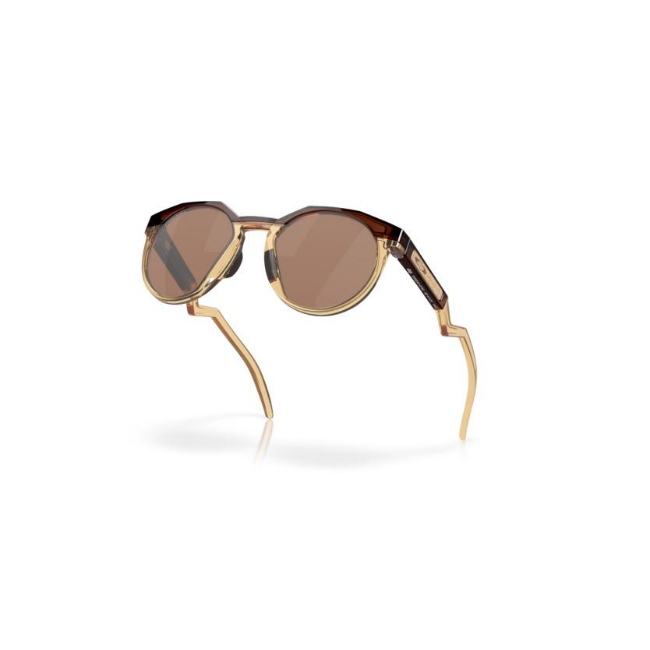 Oakley OO 9242 HSTN KYLIAN MBAPPE' SIGNATURE SERIES col. 07 è un occhiale da sole in ambra scuro/giallo curry chiaro e calibro 52.