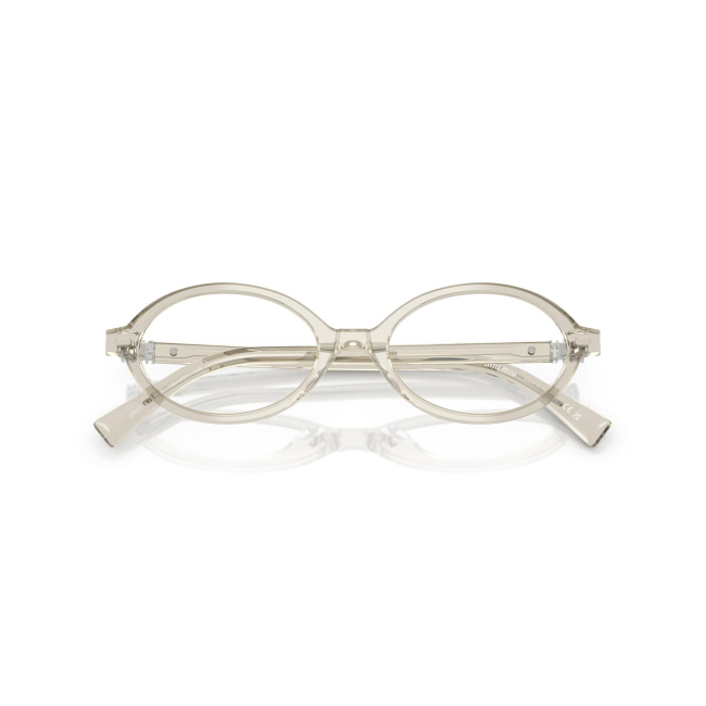 Miu Miu VMU 01X col. 12U-1O1 è una montatura da vista da donna in acetato canapa trasparente, dalla forma ovale e calibro 50.