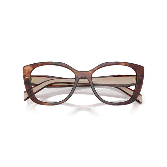 Prada VPR B04 col. 07R-1O1 è una montatura da vista da donna in acetato caramello tartarugato e beige, dalla forma cat eye e calibro 53.