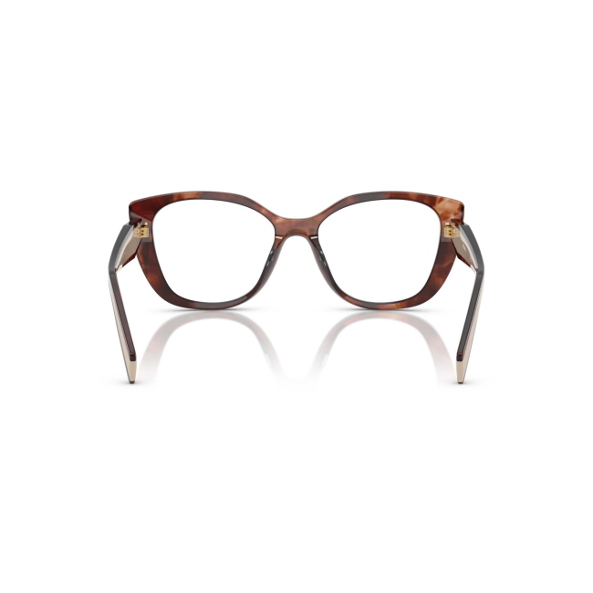 Prada VPR B04 col. 07R-1O1 è una montatura da vista da donna in acetato caramello tartarugato e beige, dalla forma cat eye e calibro 53.