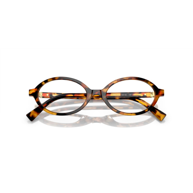 Miu Miu VMU 01X col. 19P-1O1 è una montatura da vista da donna in acetato marrone tartarugato chiaro, dalla forma ovale e calibro 50.