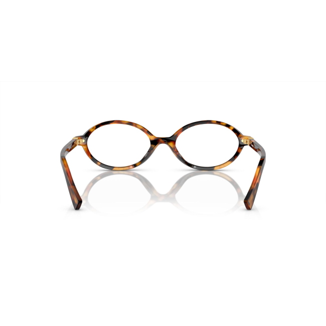 Miu Miu VMU 01X col. 19P-1O1 è una montatura da vista da donna in acetato marrone tartarugato chiaro, dalla forma ovale e calibro 50.