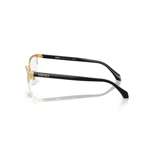 Versace VE 1304 col. 1002 è una montatura da vista da donna in metallo oro e celluloide nero, dalla forma cat eye e calibro 54.
