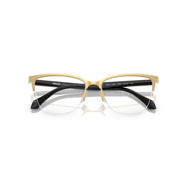Versace VE 1304 col. 1002 è una montatura da vista da donna in metallo oro e celluloide nero, dalla forma cat eye e calibro 54.