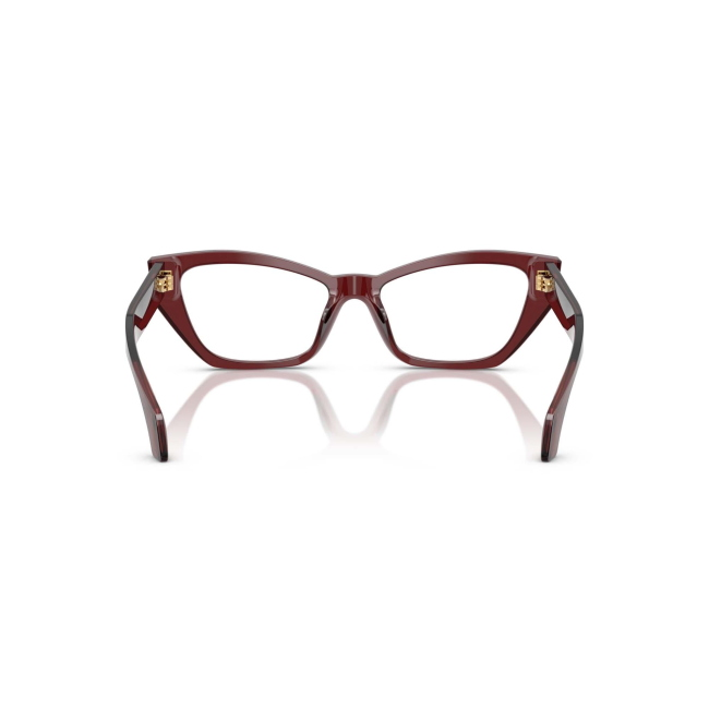 Versace VE 3373U col. 5512 è una montatura da vista da donna in acetato bordeaux trasparente, dalla forma cat eye e calibro 54.