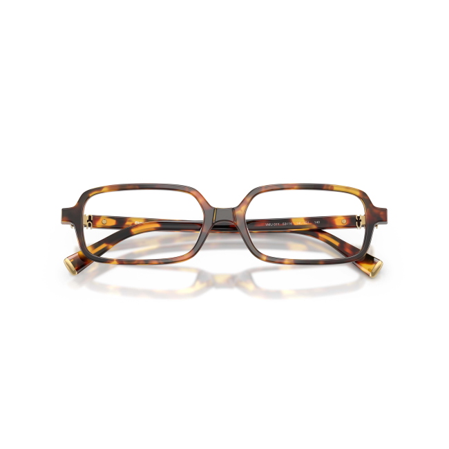 Miu Miu VMU 01Y col. 14L-1O1 è una montatura da vista da donna in acetato marrone tartarugato, dalla forma rettangolare e calibro 51.