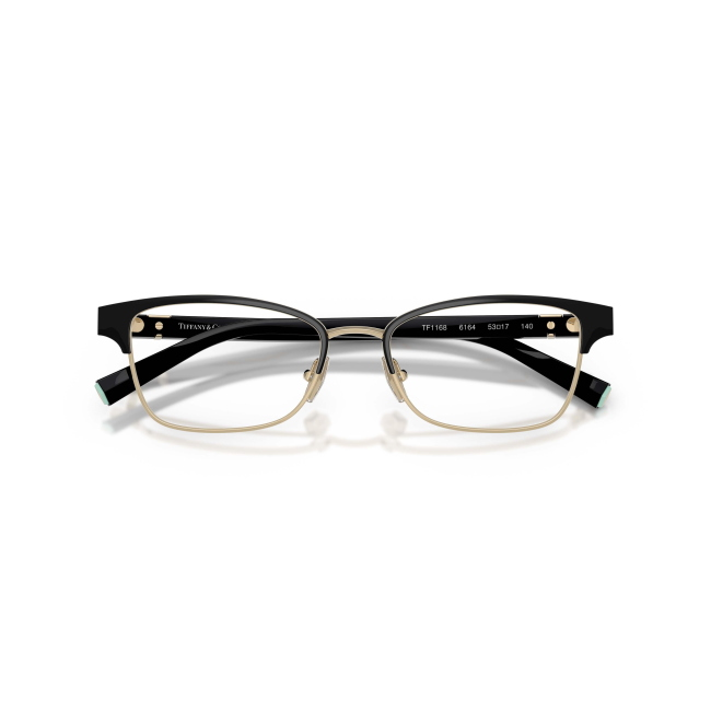 Tiffany & Co. TF 1168 col. 6164 è una montatura da vista da donna in acetato nero lucido su metallo oro pallido, dalla forma pillow e calibro 53.