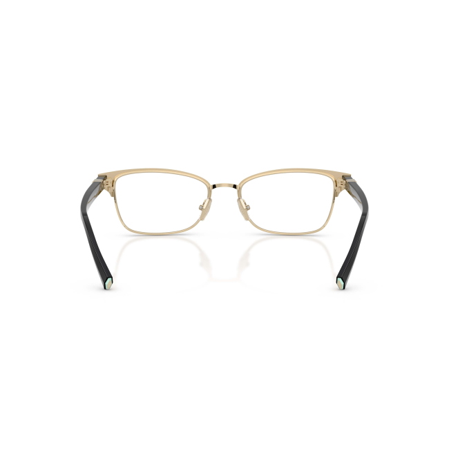 Tiffany & Co. TF 1168 col. 6164 è una montatura da vista da donna in acetato nero lucido su metallo oro pallido, dalla forma pillow e calibro 53.