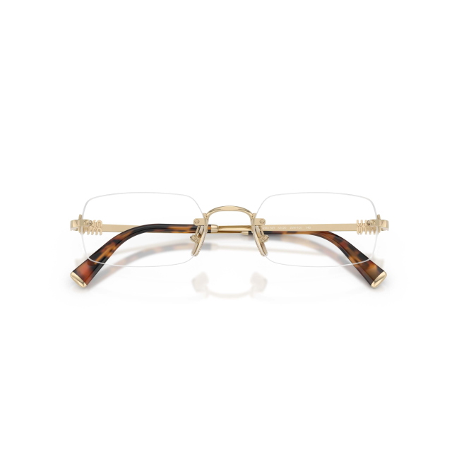 Miu Miu VMU 50Y col. ZVN-1O1 è una montatura da vista da donna in metallo oro pallido, dalla forma rettangolare e calibro 52.