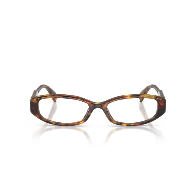 Miu Miu VMU 06Z col. 14L-1O1 interpreta il modello con acetato MARRONE TARTARUGATO. La forma Rettangolare e il calibro 54 ne definiscono il carattere.